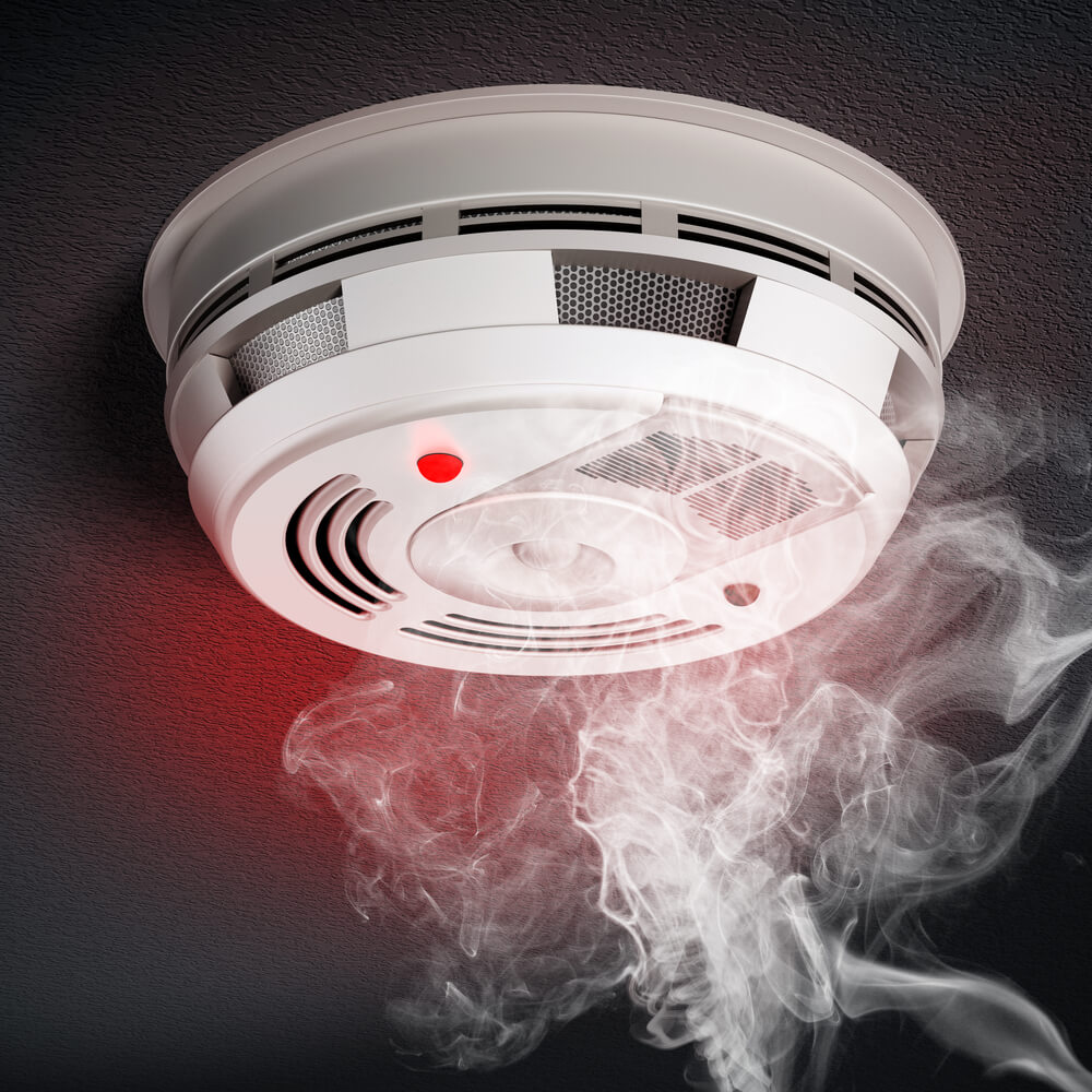 Smoke alarm installer testing alarm in Clapham - SW4 property